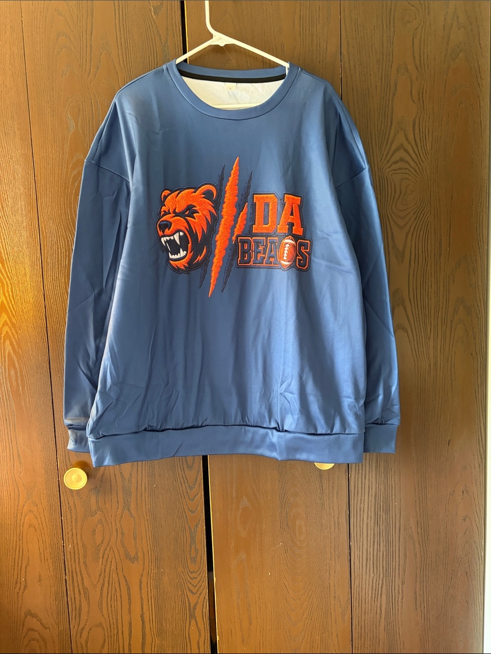 Men's Blue Crewneck Sweatshirt with Orange Bear Graphic. Large. New in the bag.